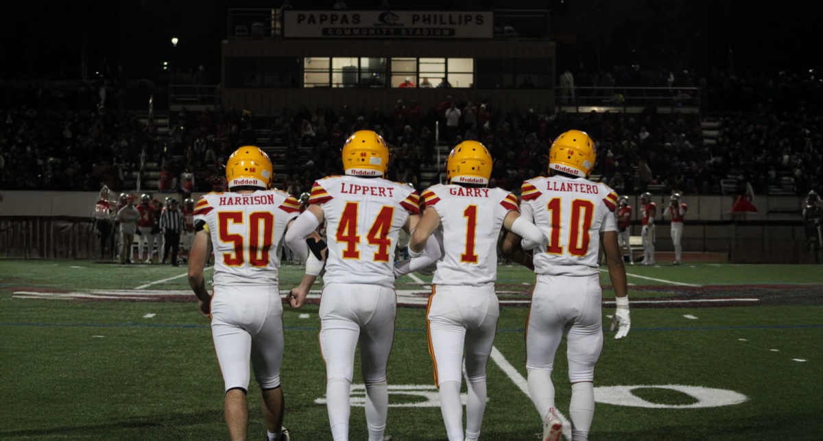 Varsity captains take the field | Photo Credit – Leah Porzig