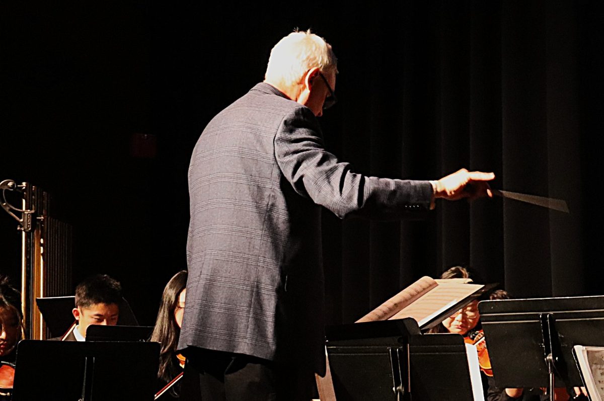 Dr. Warren conducting the orchestra