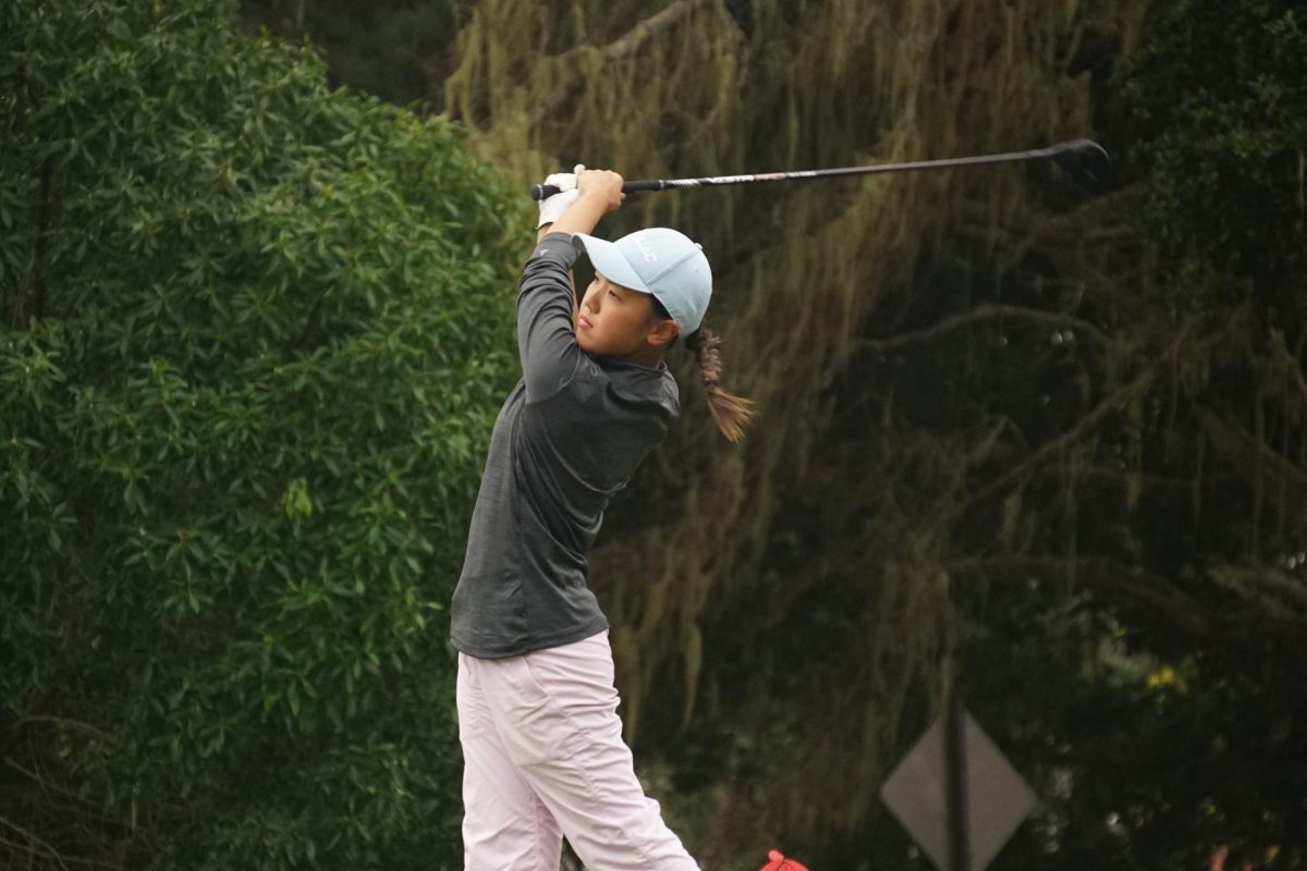 Senior Harper Szpur teeing off on hole three at the PG Links