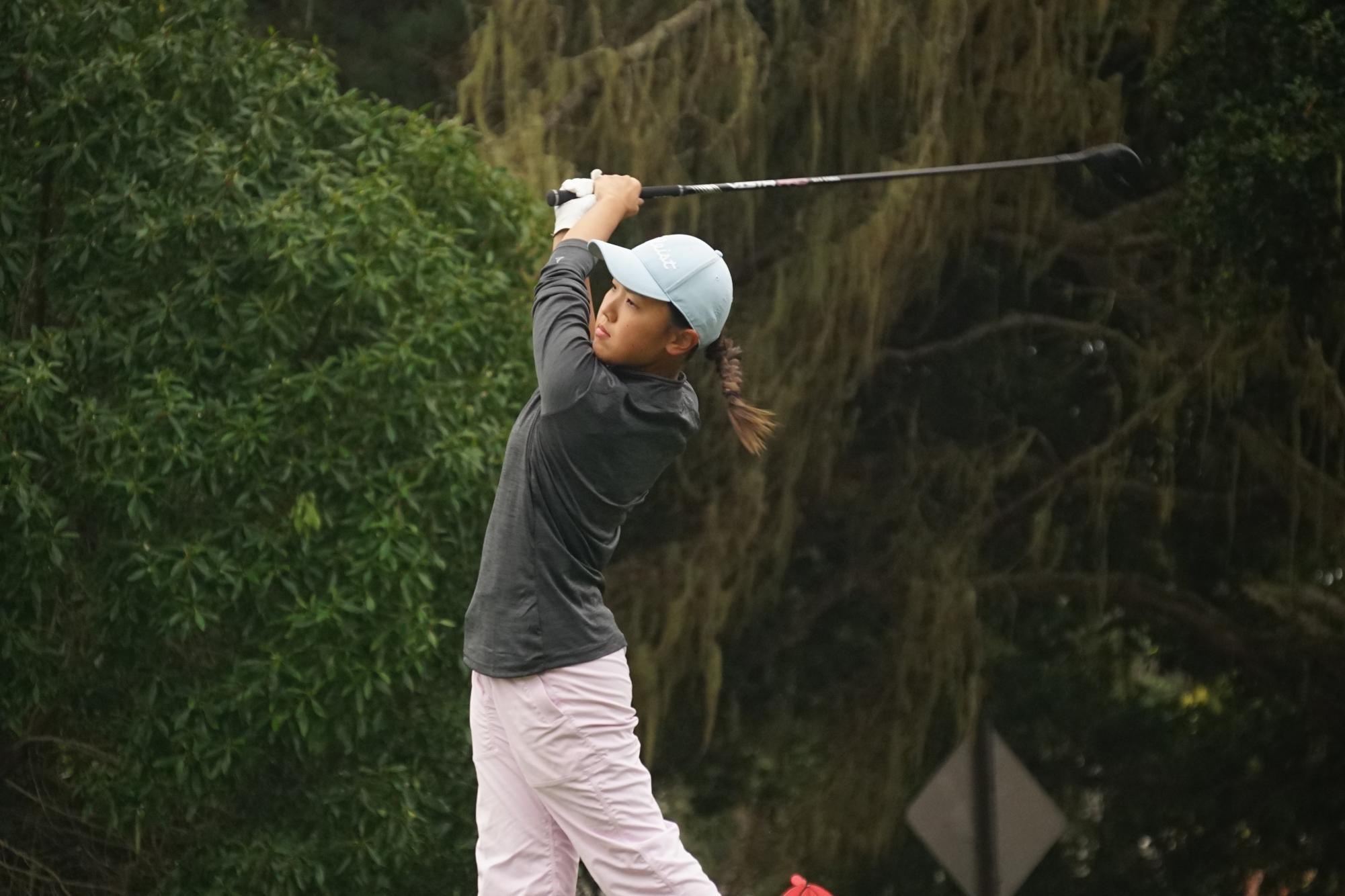 Senior Harper Szpur teeing off on hole three at the PG Links